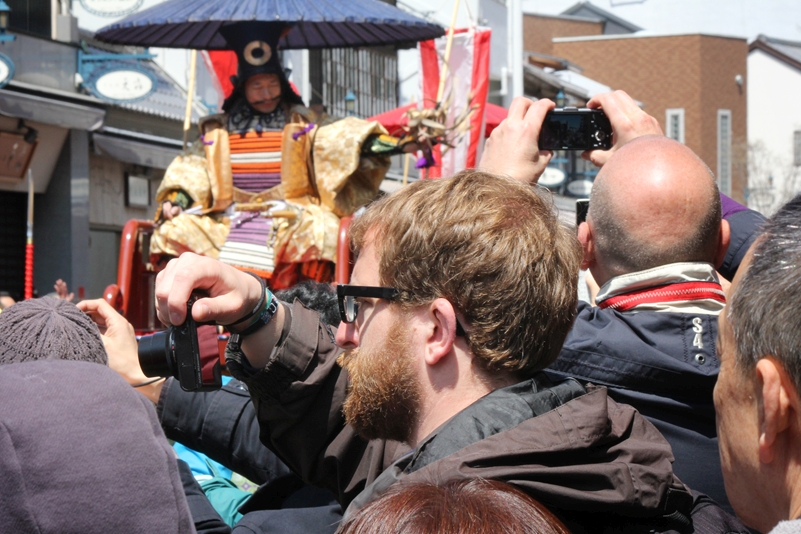 Inbound tourists photograph a cosplay parade